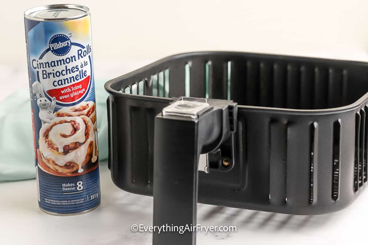 cinnamon roll pastry and an air fryer tray