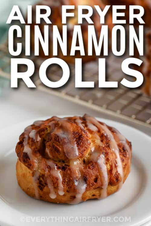 cinnamon roll on a plate with text