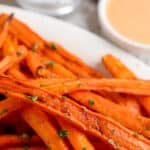 air fryer carrot fries on a plate with text
