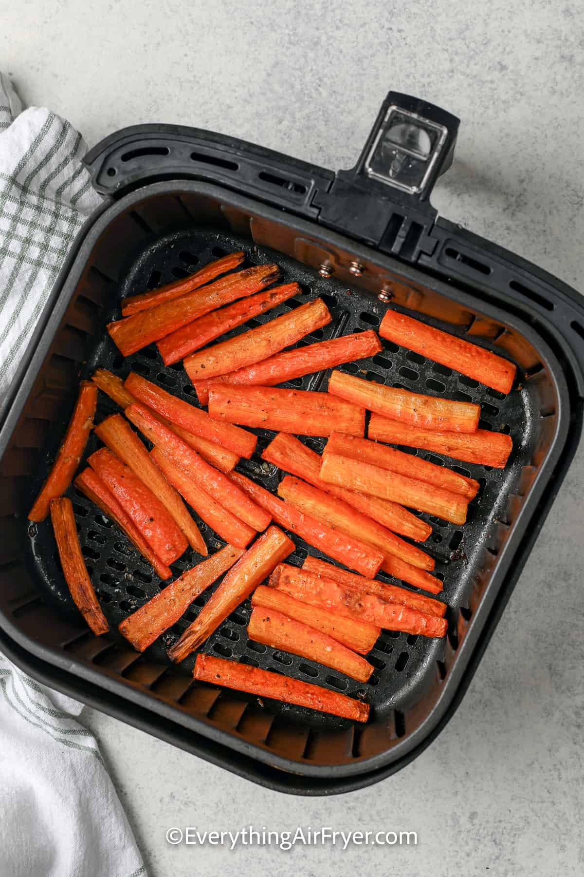 cooked air fryer carrots in an air fryer tray