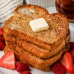 stack of air fryer french toast on a plate with strawberries