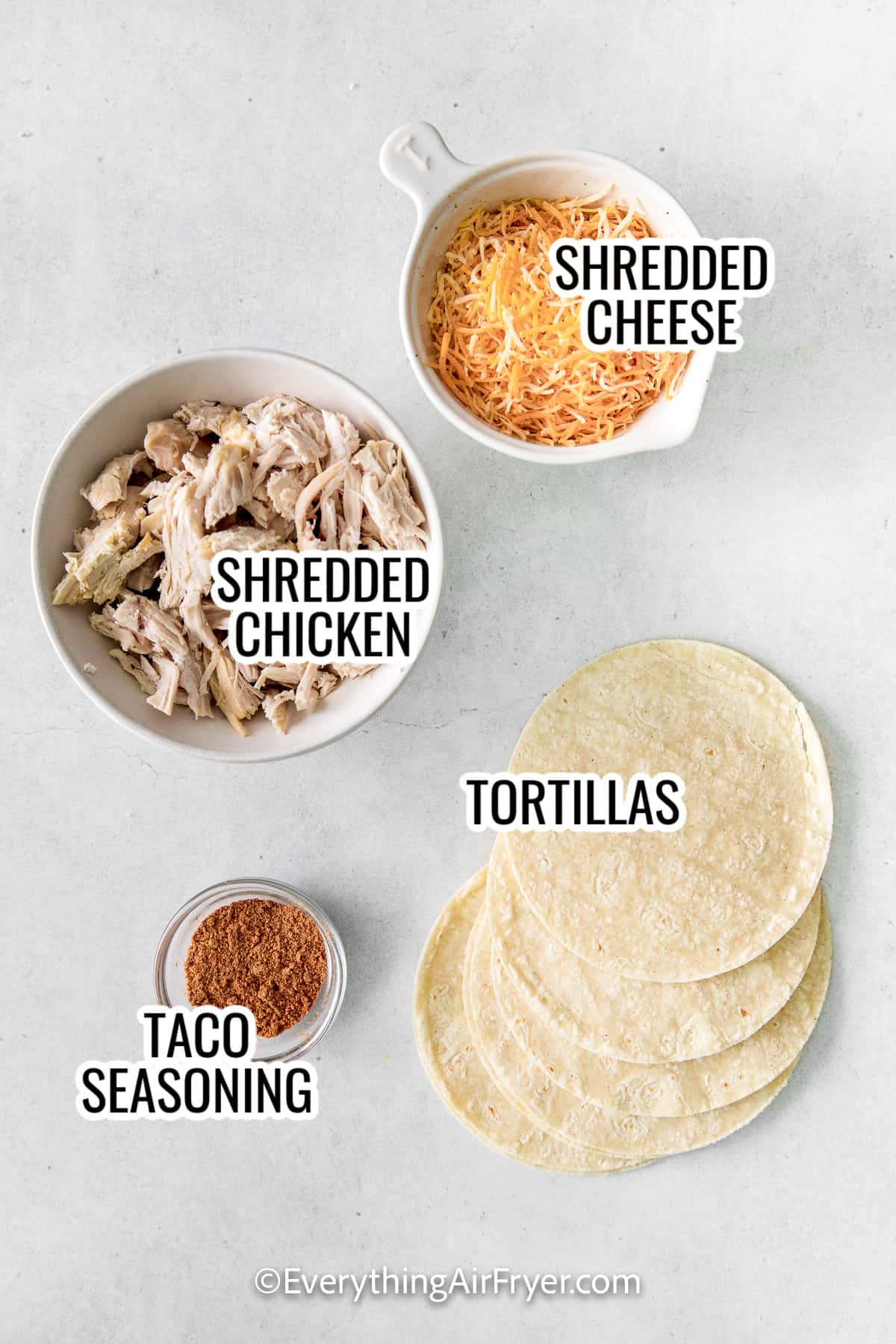 air fryer chicken taquitos including shredded chicken, shredded cheese, tortillas, and taco seasoning