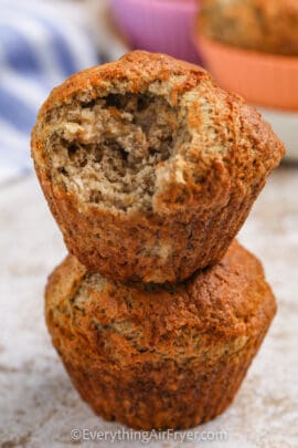 Air Fryer Banana Muffins with a bite taken out of one