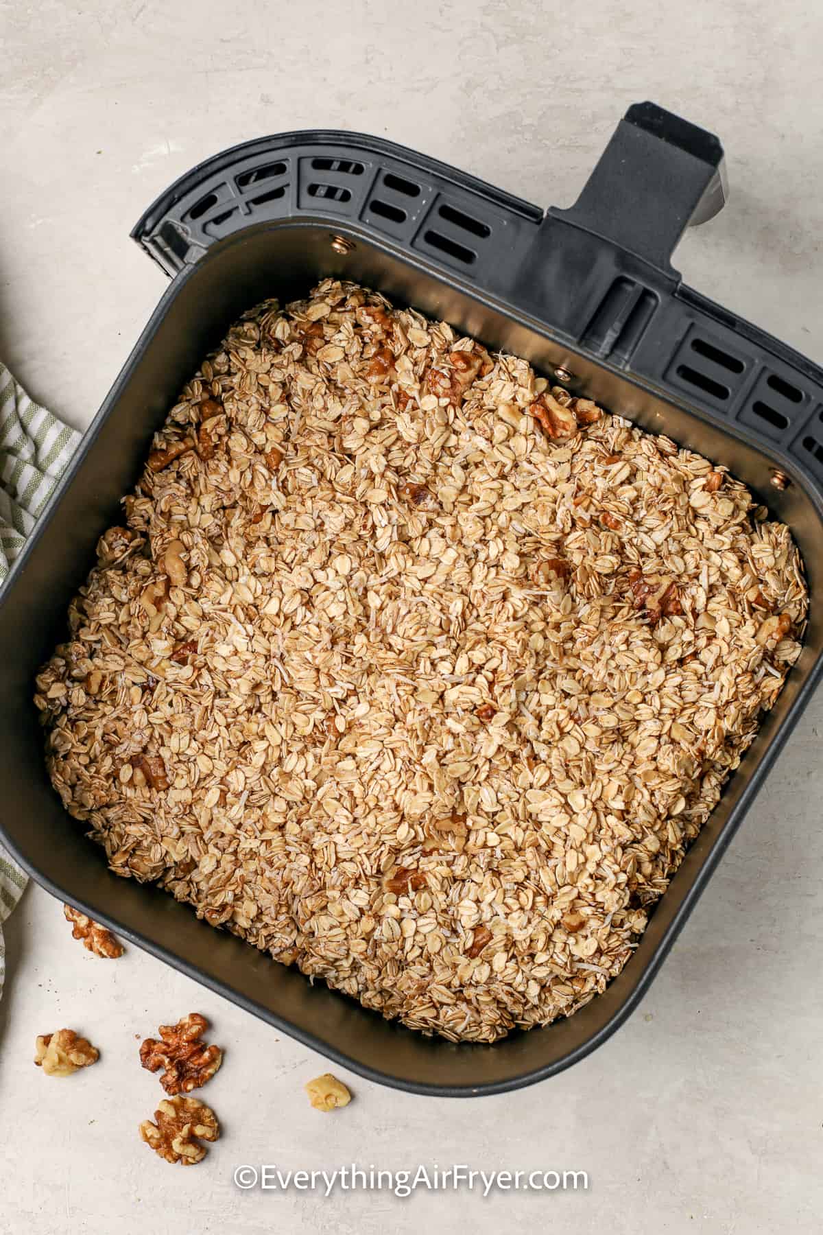uncooked air fryer granola packed in an air fryer tray