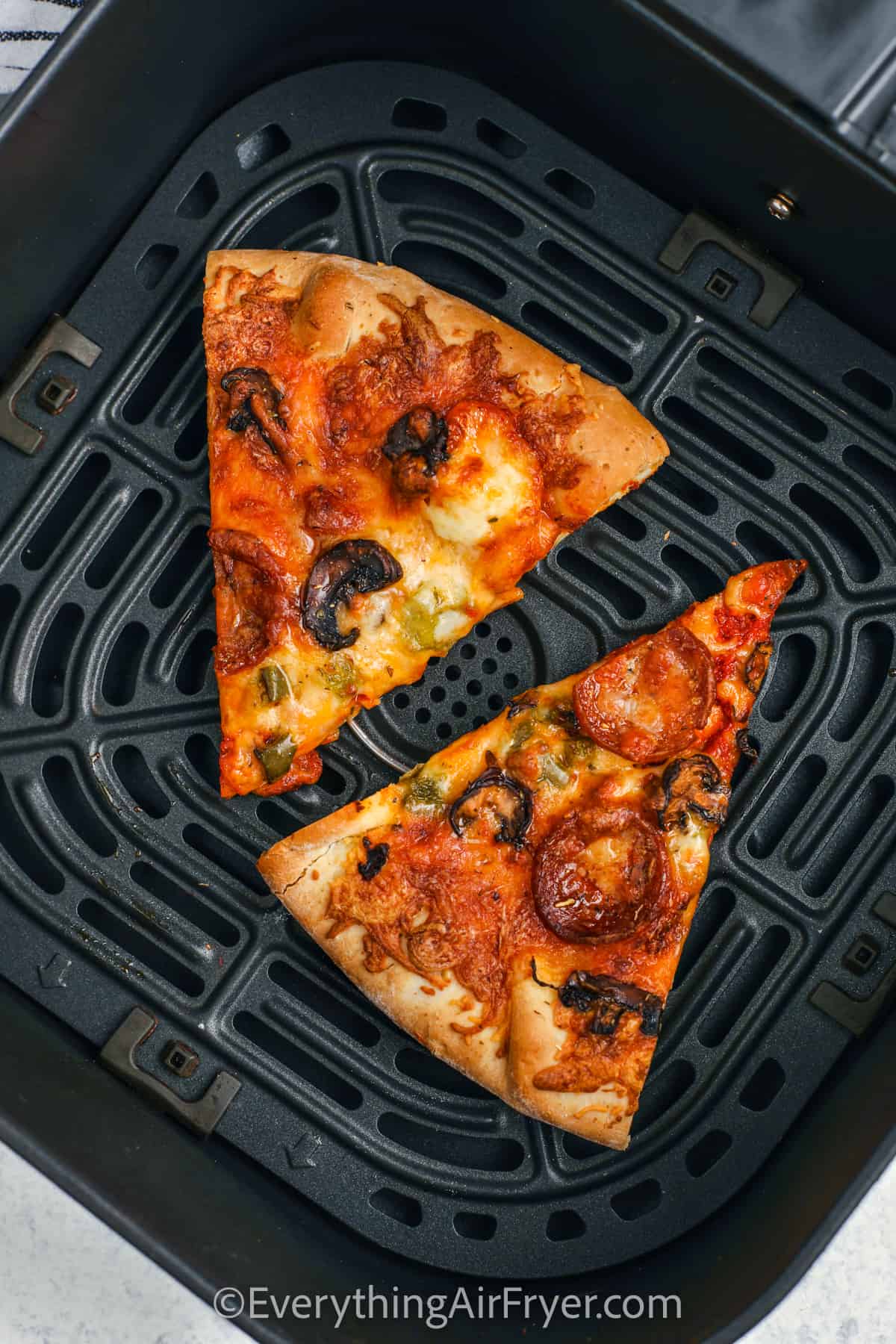 pizza in the air fryer to show How to Reheat Pizza in the Air Fryer