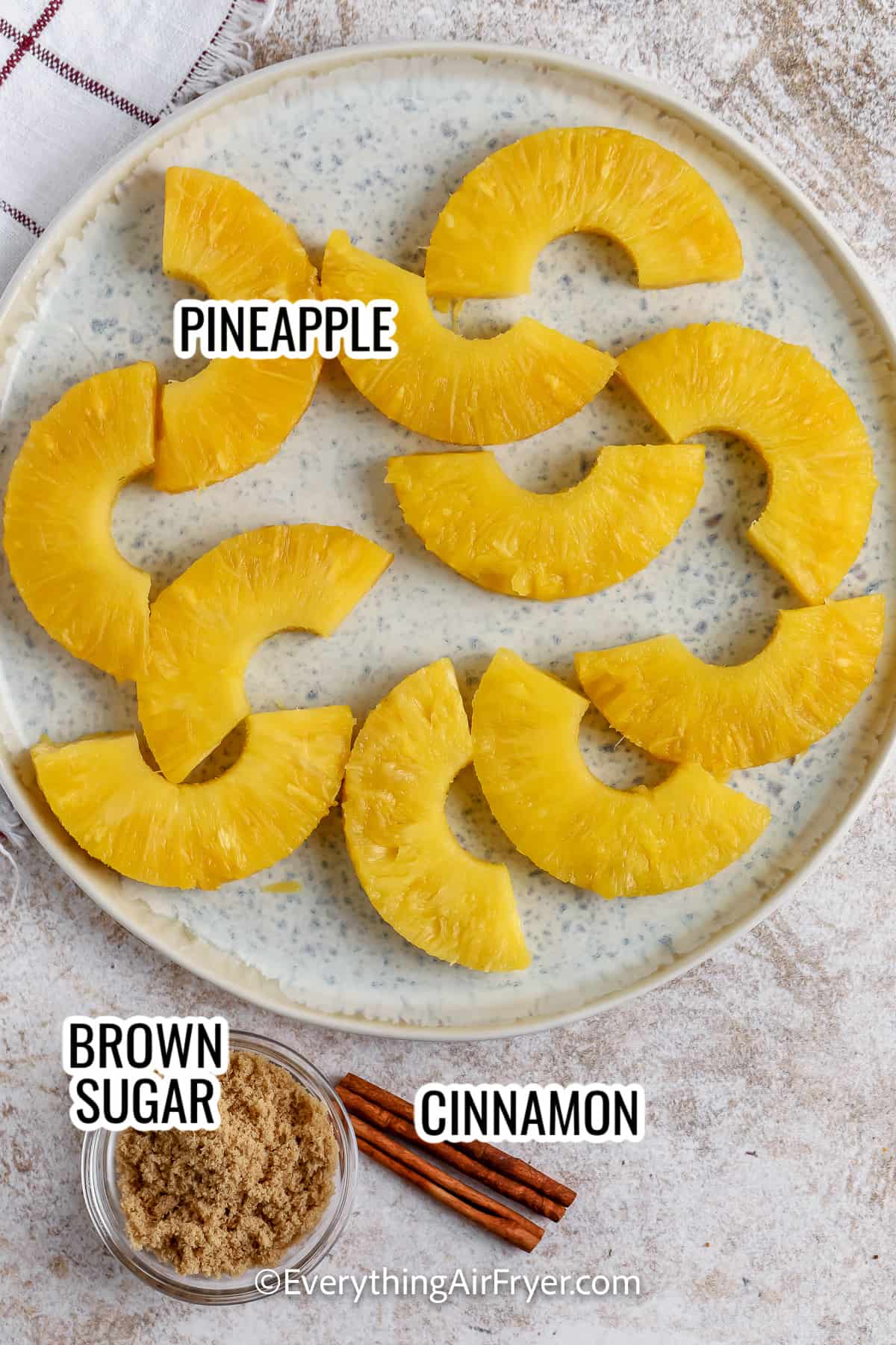 ingredients assembled to make air fryer pineapple including pineapple, brown sugar, and cinnamon