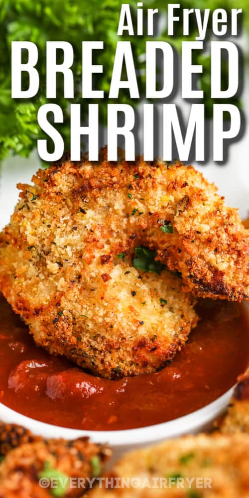 close up of dipping Air Fryer Breaded Shrimp with writing