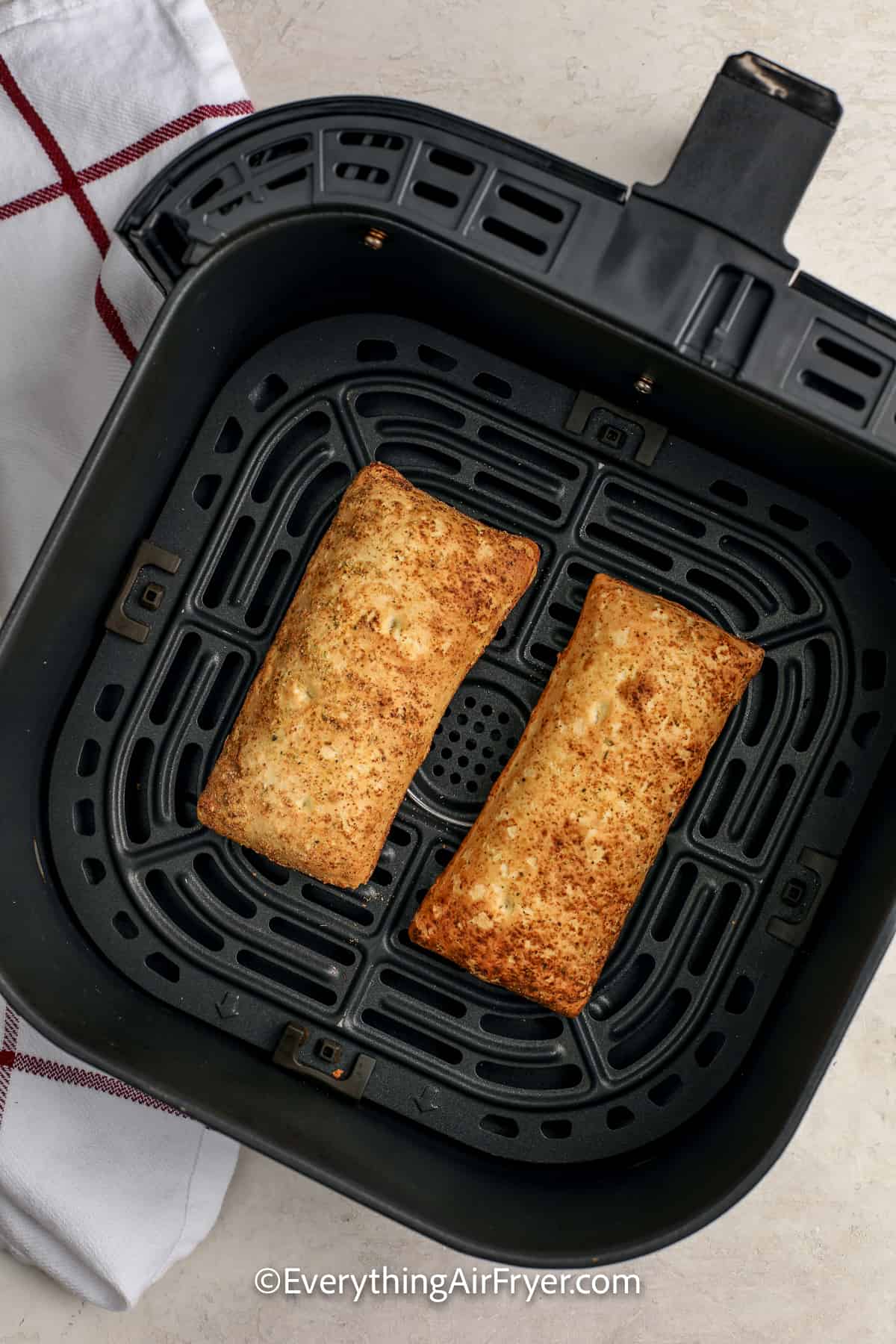 cooked hot pockets in an air fryer tray