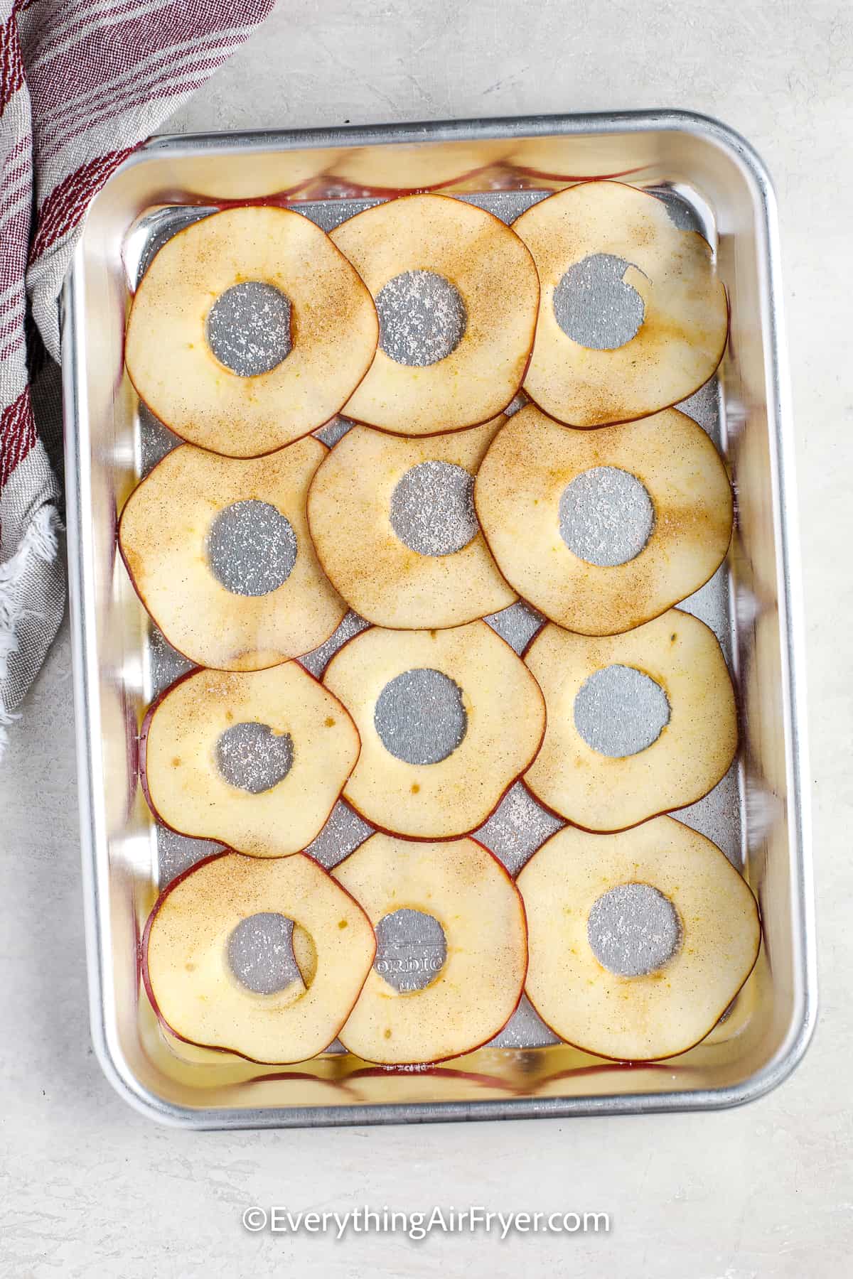 sliced apples on a baking tray