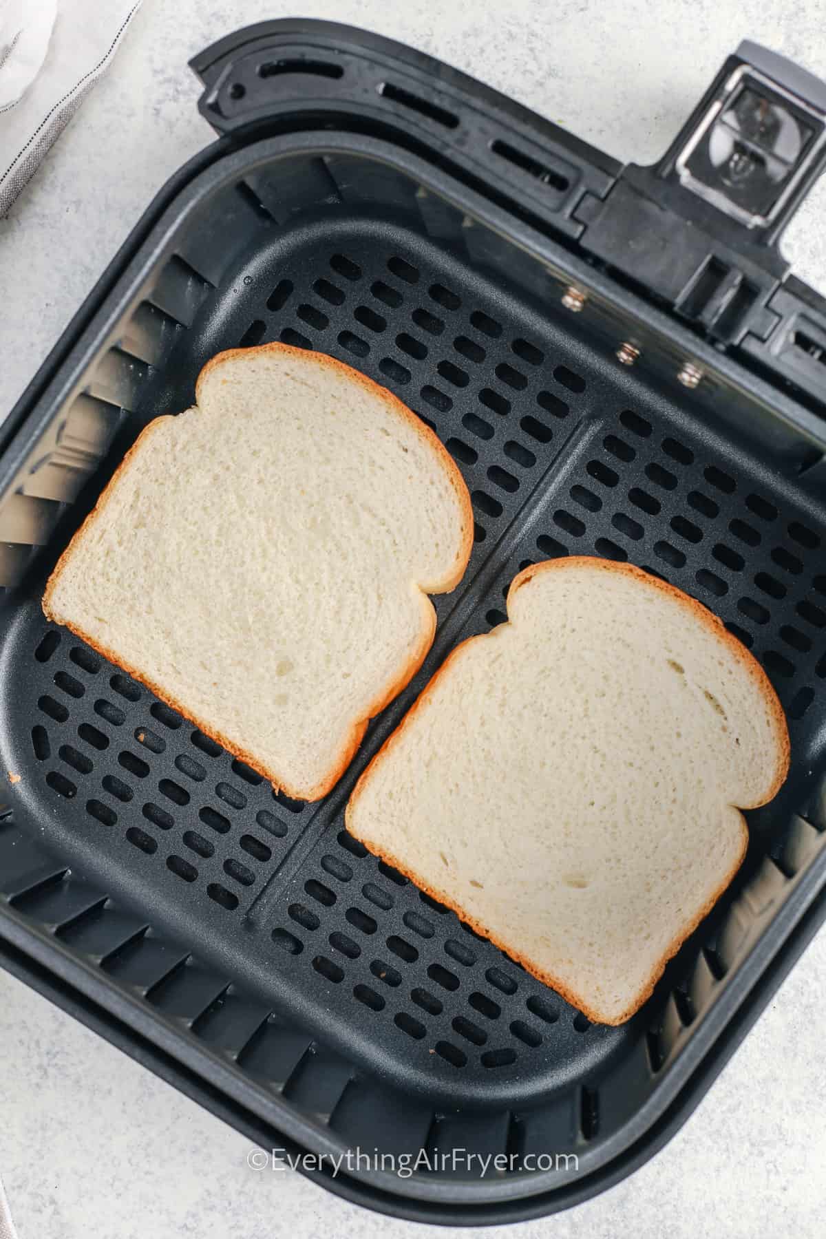 adding bread to fryer to make Air Fryer Toast