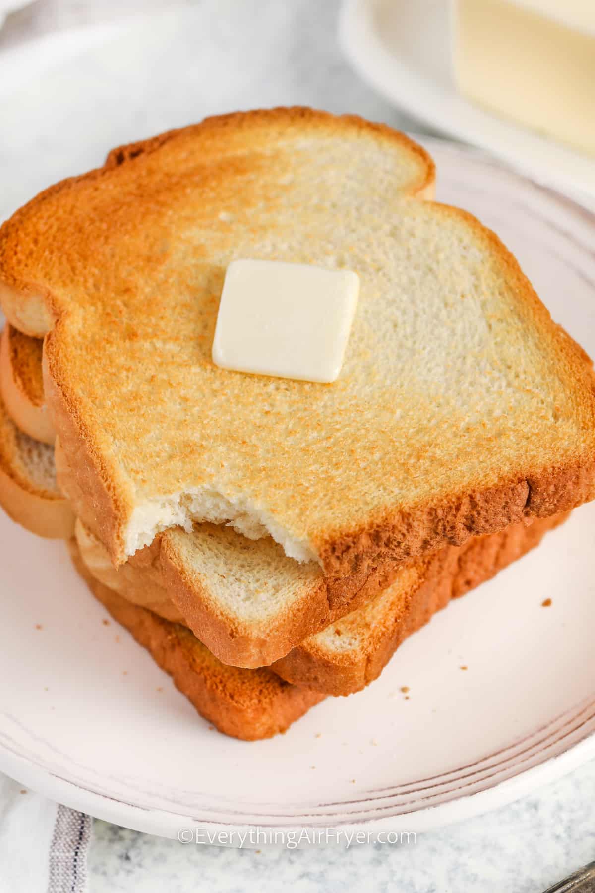 Air Fryer Toast with a bite taken out