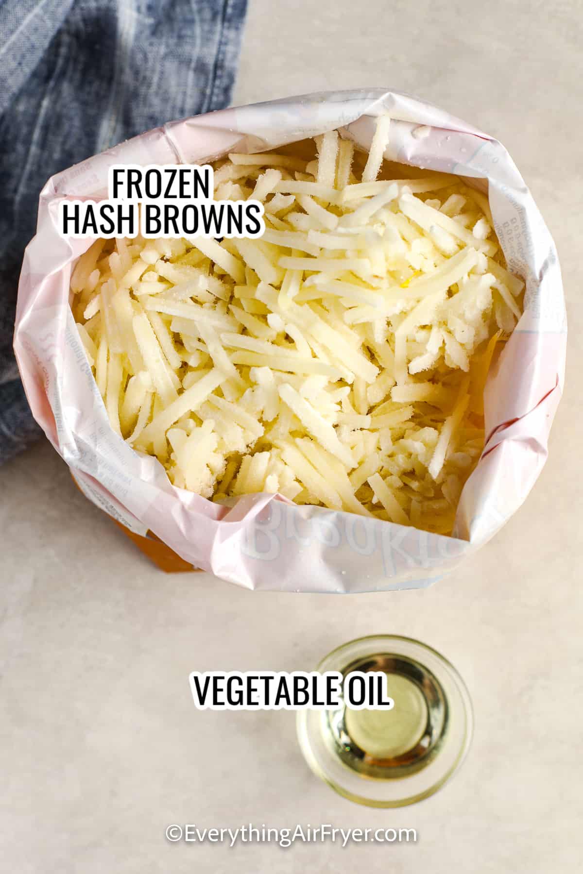 ingredients assembled to make air fryer hash browns, including frozen hash browns and vegetable oil