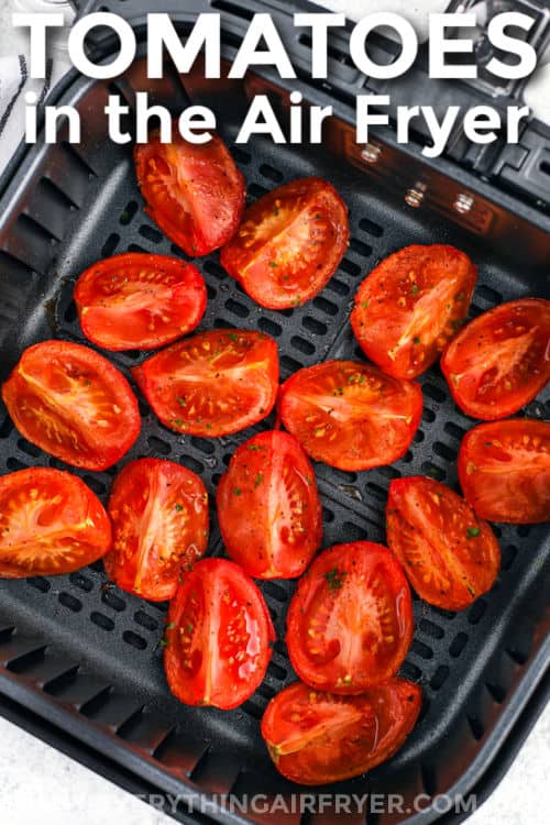 Air Fryer Tomatoes in the fryer with a title