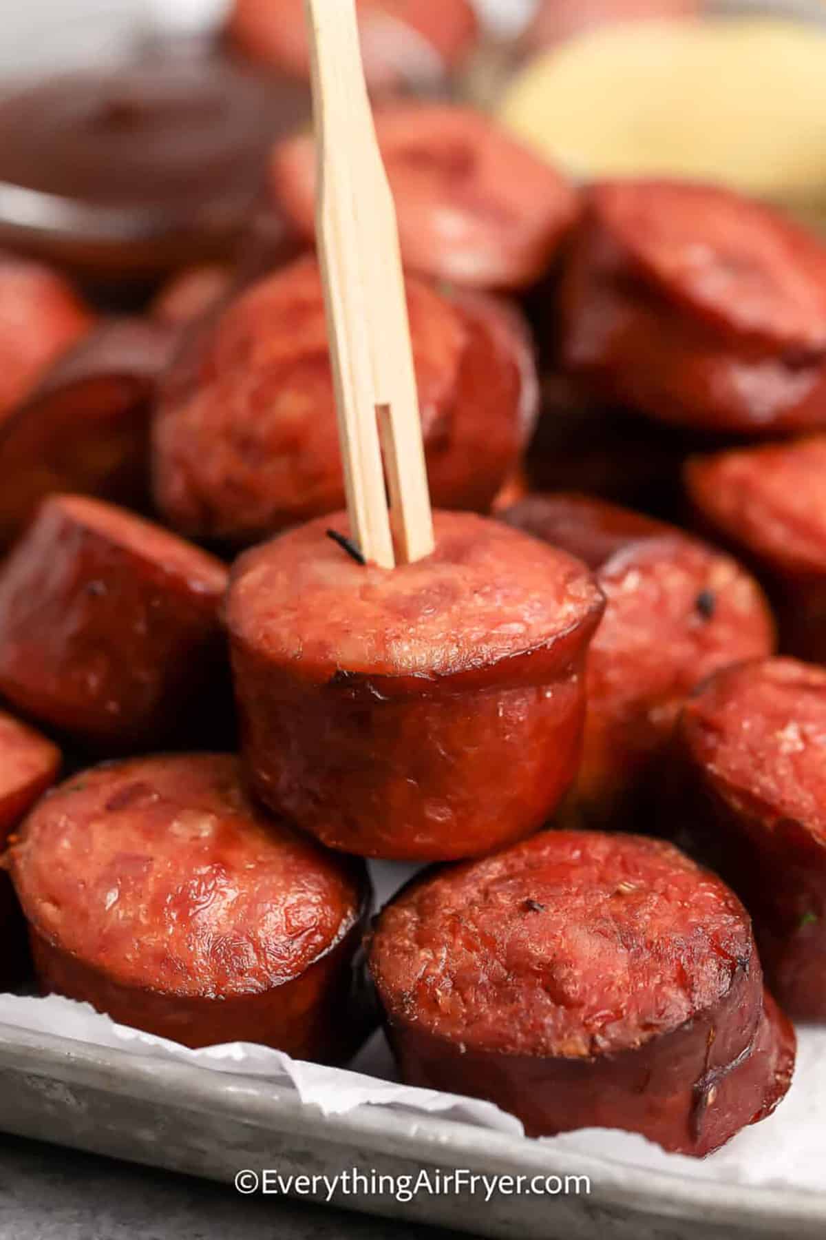 Air Fryer Smoked Sausage with a pick in it.