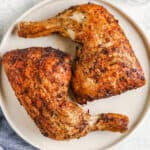Air fryer chicken quarters on a plate