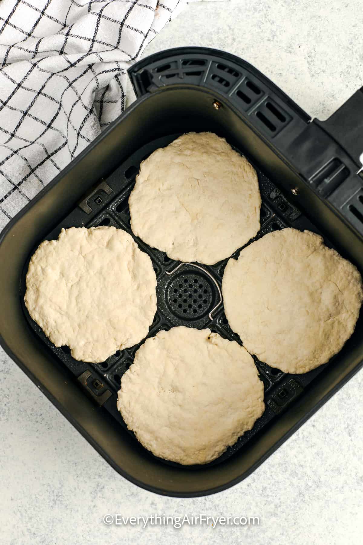 pizza crusts in an air fryer tray