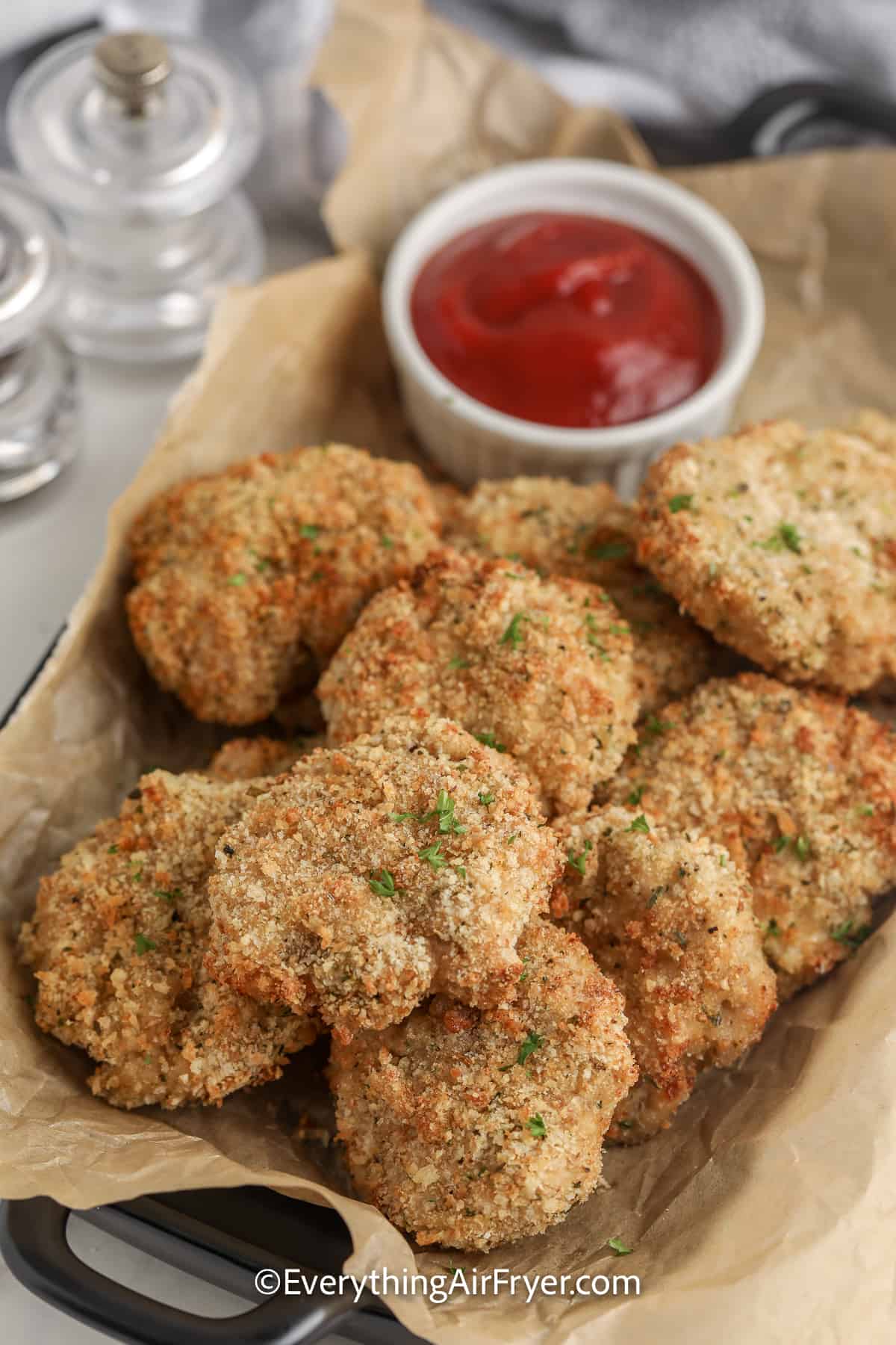 dish of homemade chicken nuggets with dipping sauce