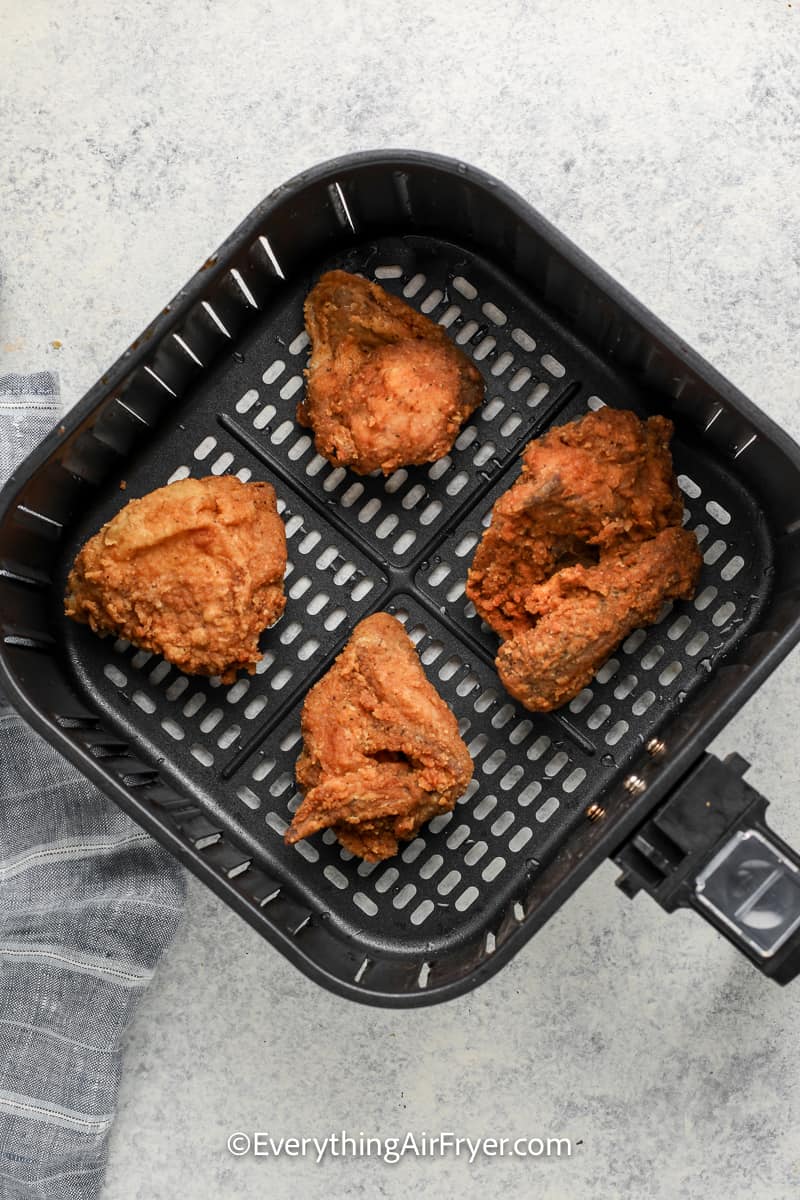 fried chicken in an air fryer tray