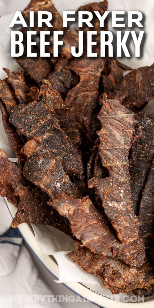 air fryer beef jerky in a dish with text