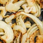 Air Fryer Onions in the fryer with a title