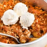 Air Fryer Apple Crisp topped with ice cream