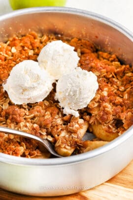 Air Fryer Apple Crisp topped with ice cream