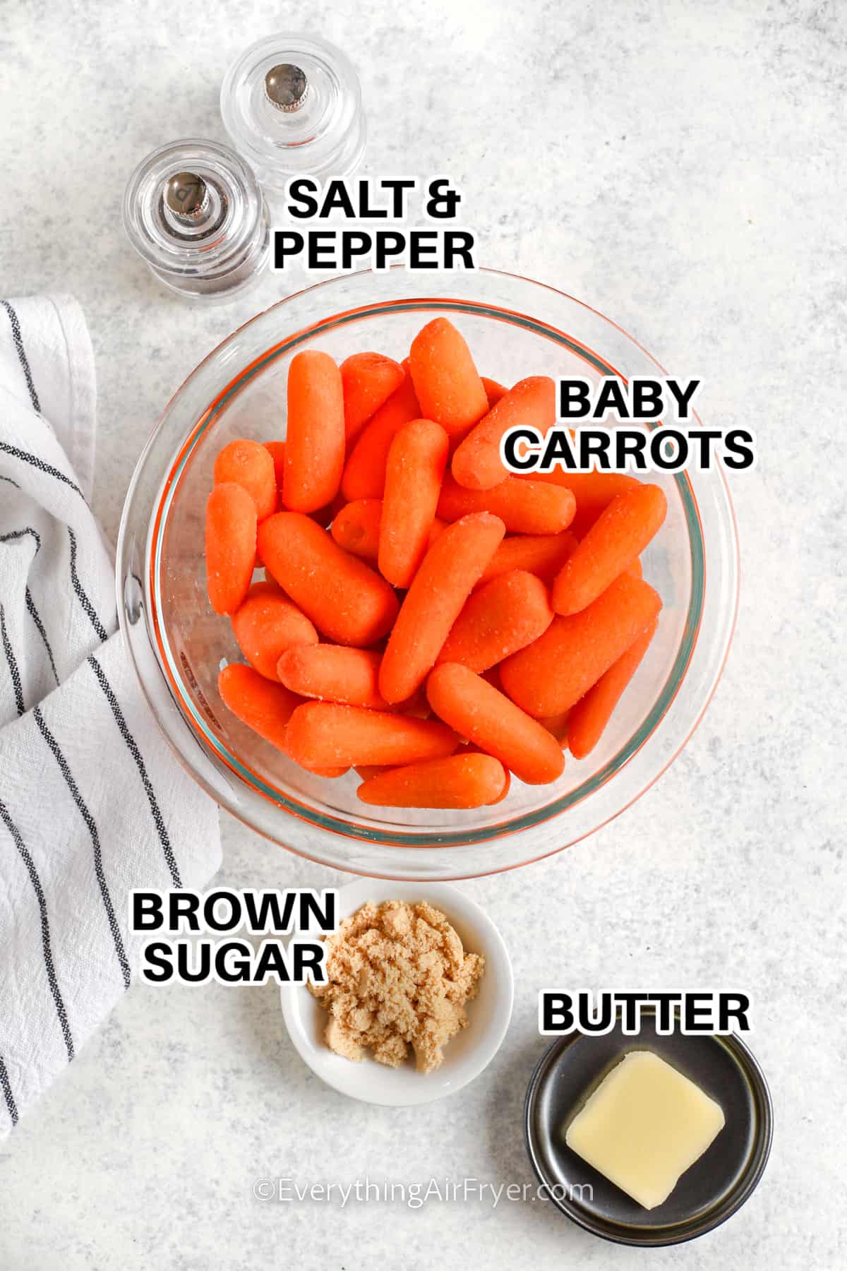 Ingredients to make Air Fryer Baby Carrots labeled: carrots, brown sugar, butter, salt and pepper