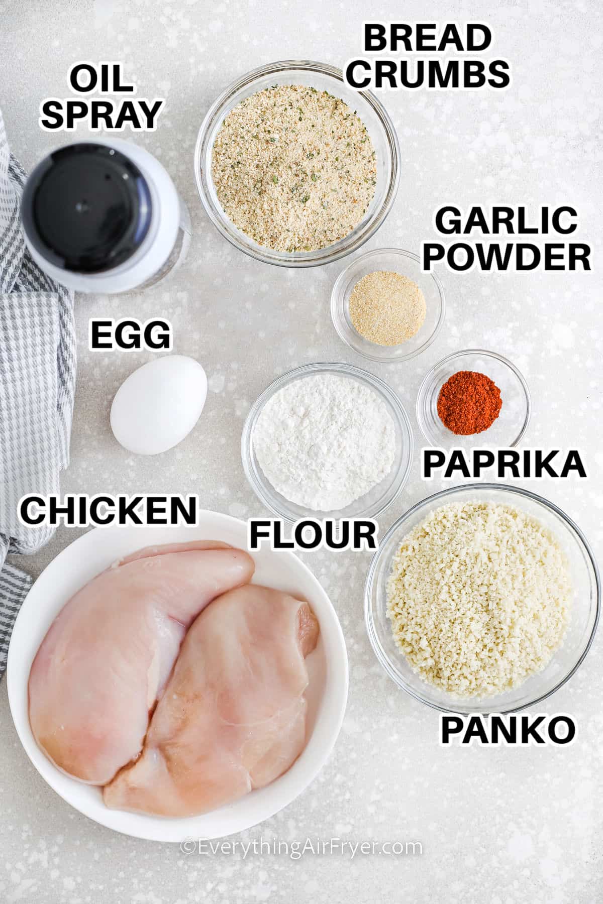 bread crumbs , oil spray , garlic powder , paprika , flour , chicken , egg and panko with labels to make Air Fryer Popcorn Chicken