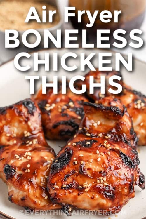 Air fryer boneless chicken thighs on a serving plate with text