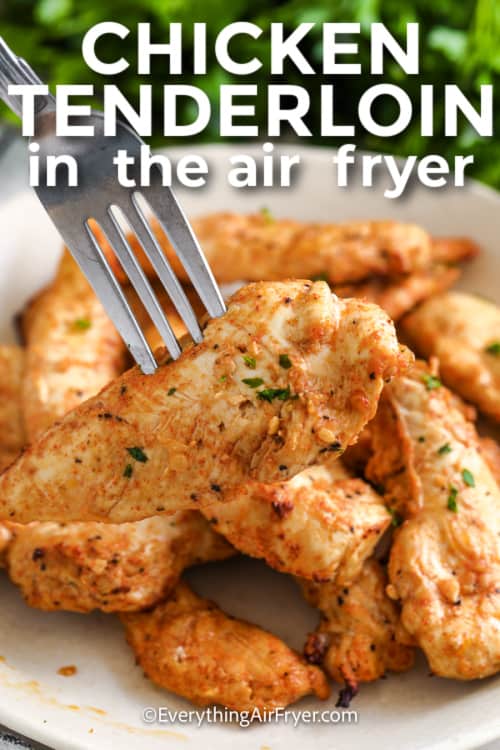 close up of air fryer chicken tenderloins with a fork and writing