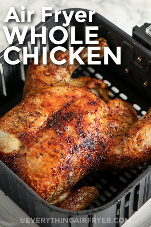A whole chicken cooked in the air fryer with text
