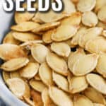 air fryer pumpkin seeds in a bowl with a title