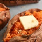 air fryer baked sweet potatoes topped with butter with text