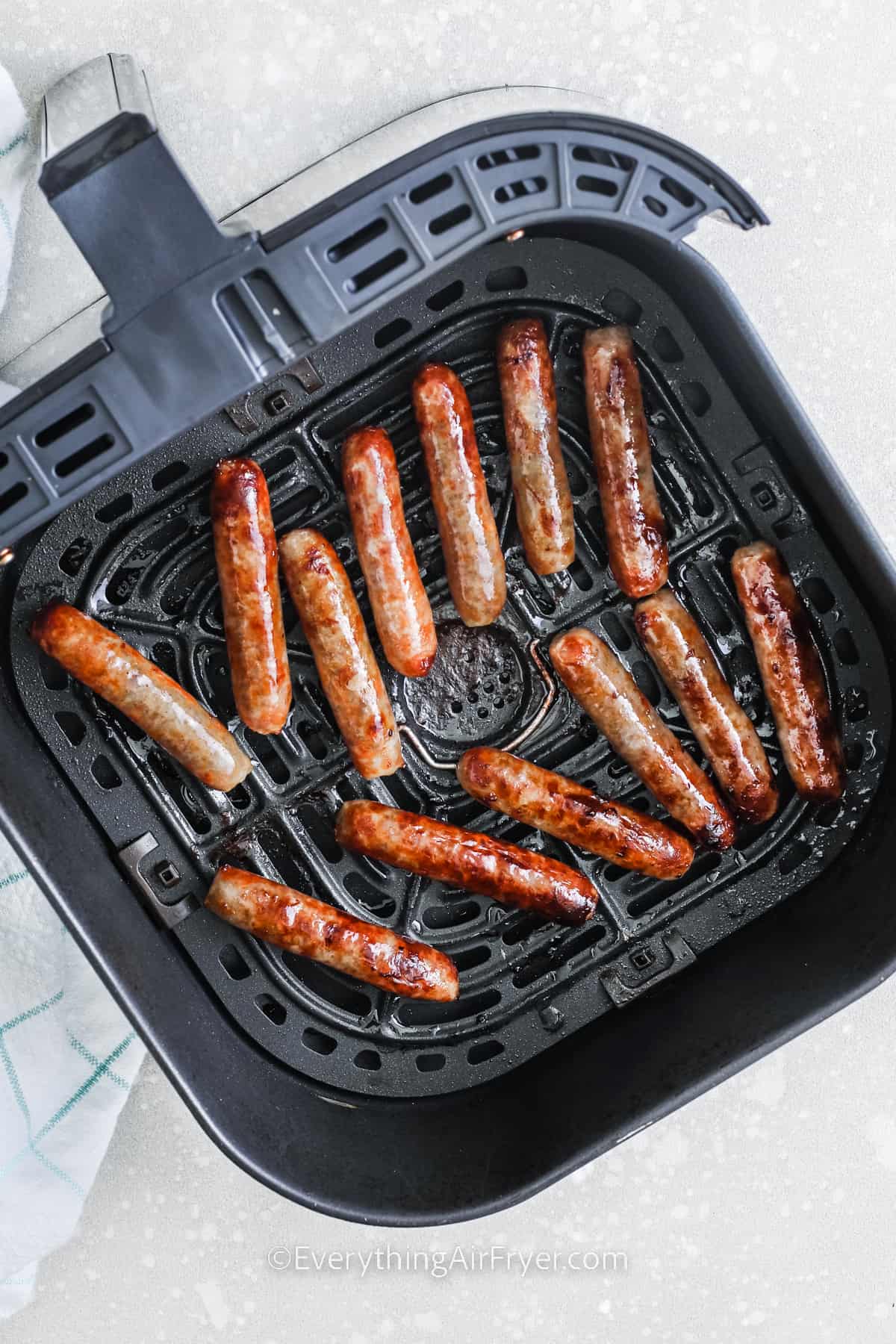 Breakfast Sausages in an air fryer basket