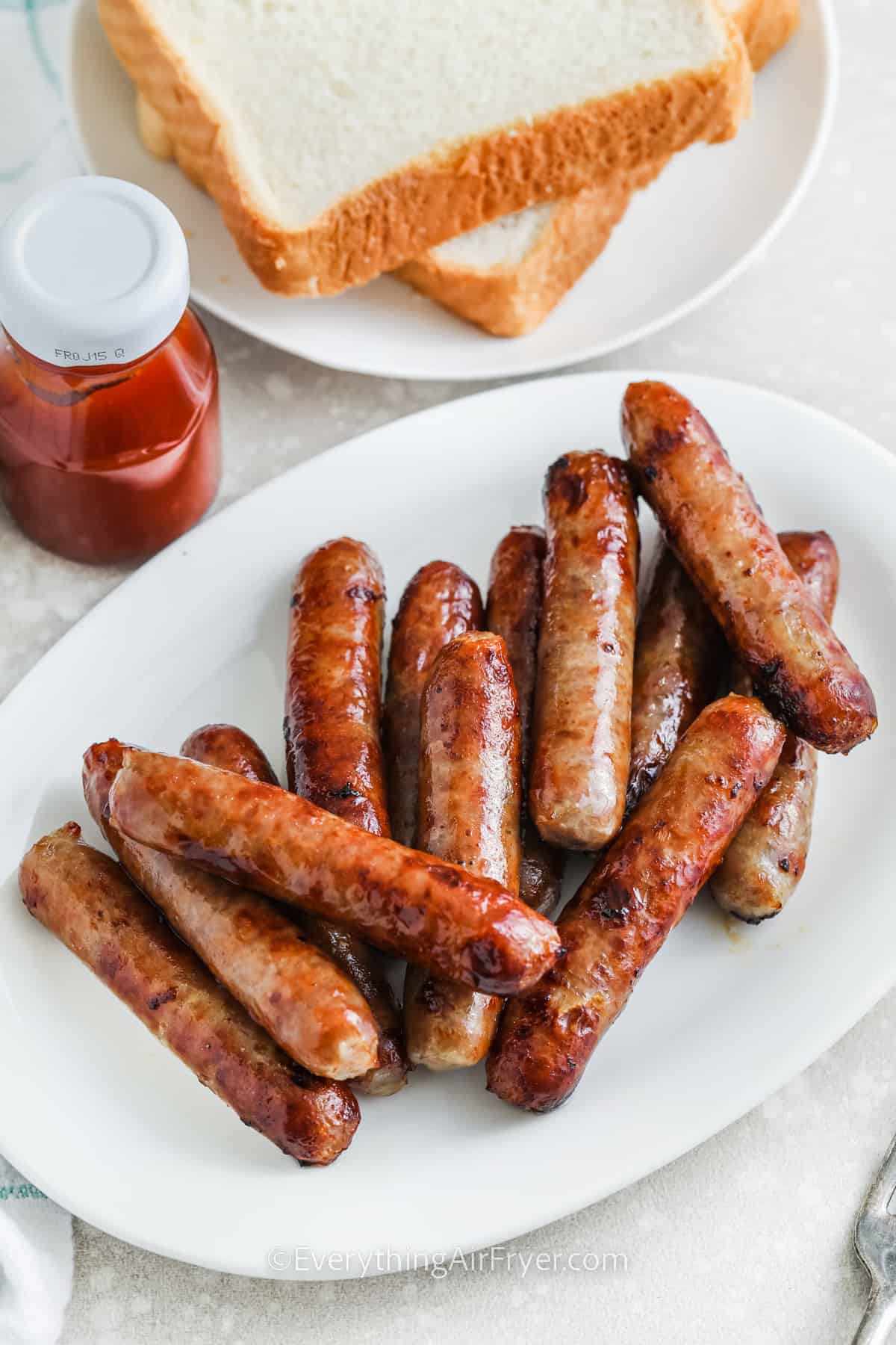 a white plate full of Air Fryer Breakfast Sausages