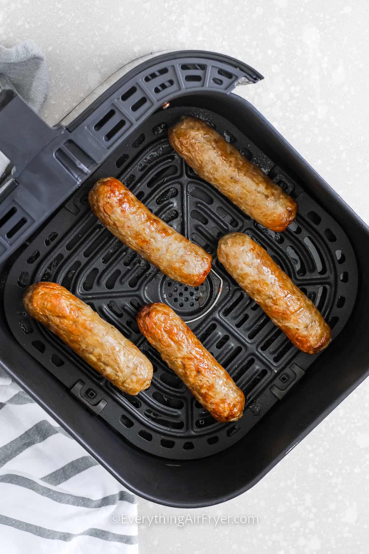 Air fryer chicken sausage in an air fryer basket