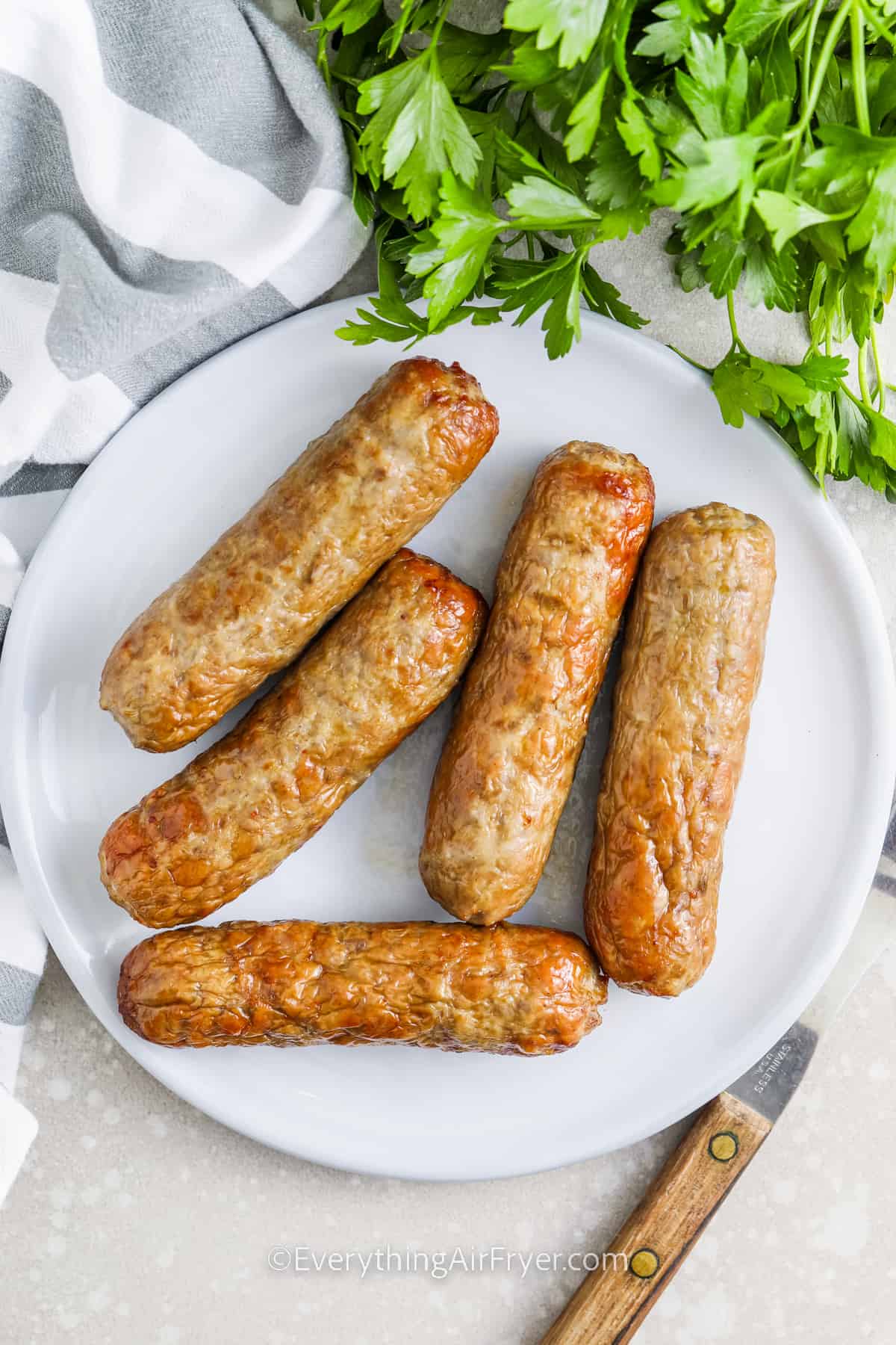 white plate with Air fryer chicken sausage