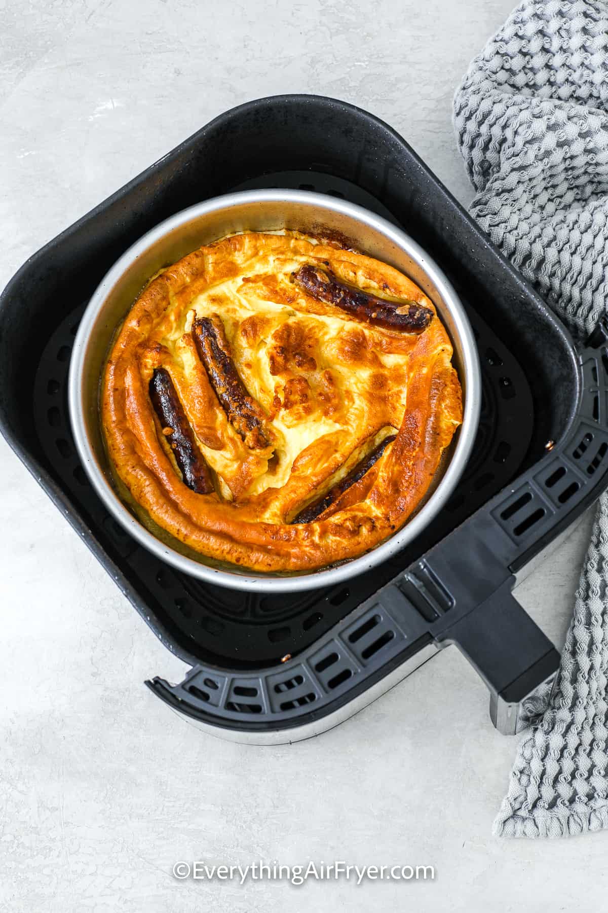 cooked air fryer toad in a hole in a dish in an air fryer tray
