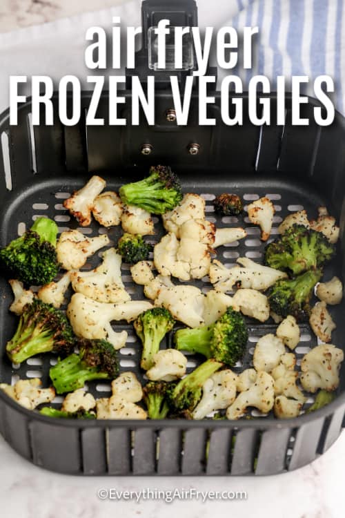 air fryer basket with cooked veggies and a title