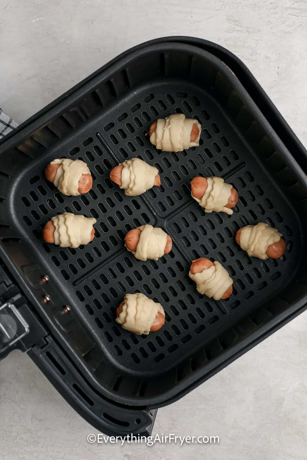 Pigs in a Blanket in the air fryer before being baked