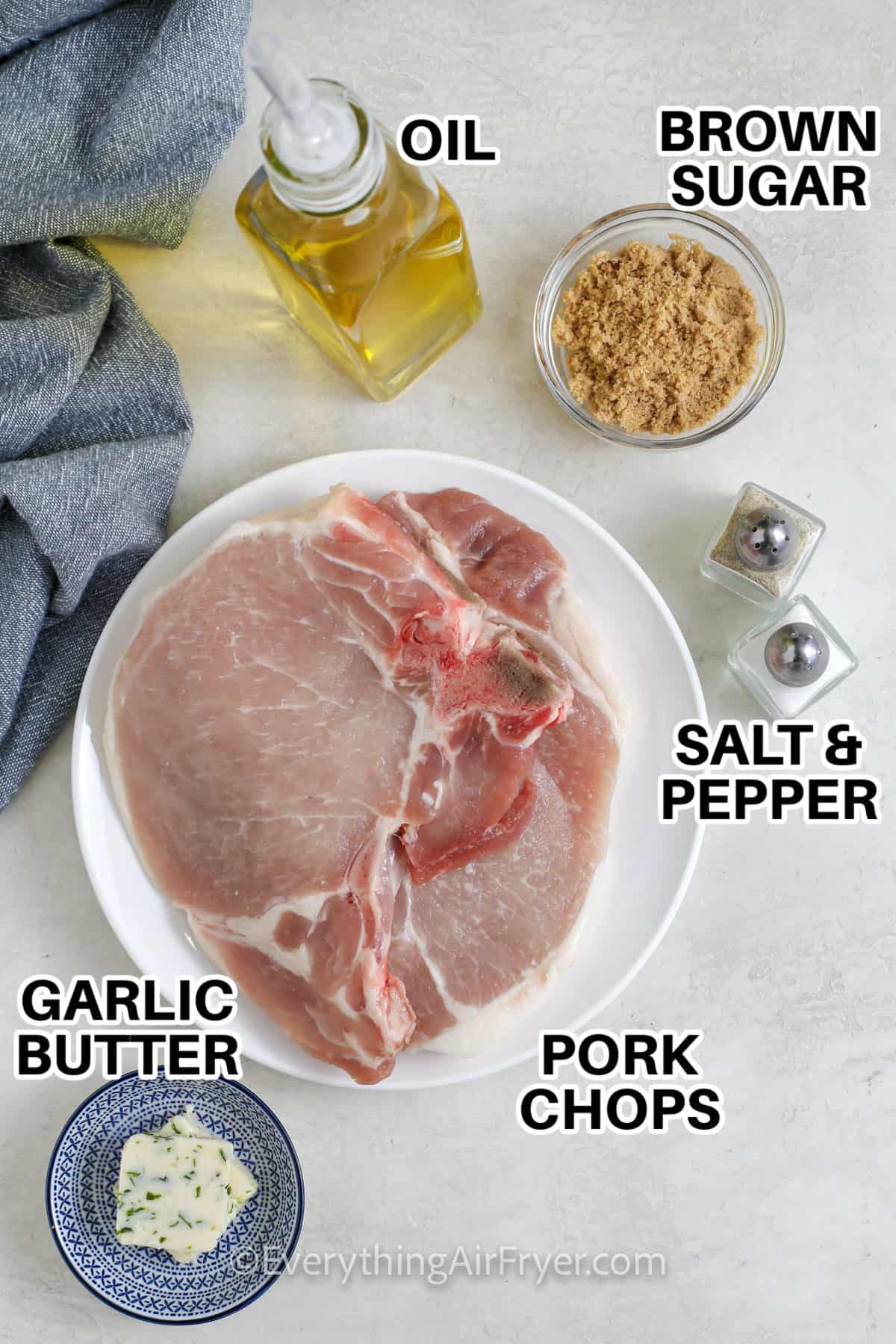 oil , brown sugar , salt and pepper , pork chops , and garlic butter with labels to make Air Fryer Bone In Pork Chops