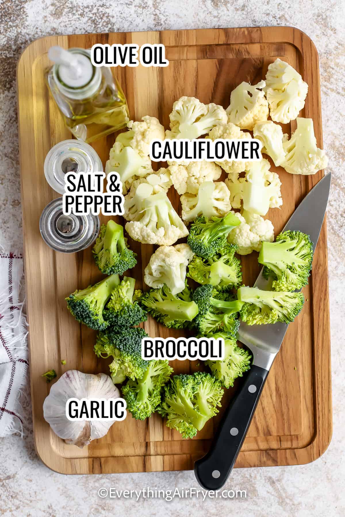ingredients for air fryer cauliflower and broccoli, including cauliflower, broccoli, olive oil, and garlic