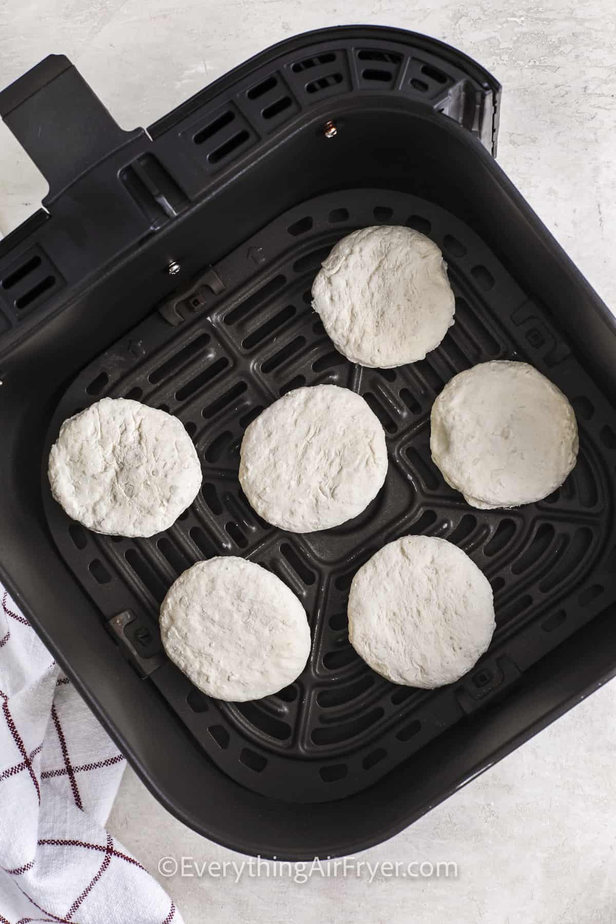 Frozen biscuits in an air fryer basket