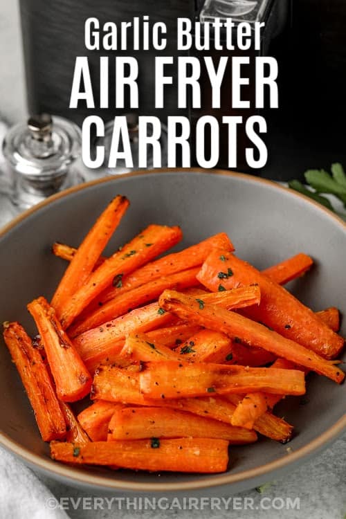 Garlic butter air fryer carrots in a bowl with text