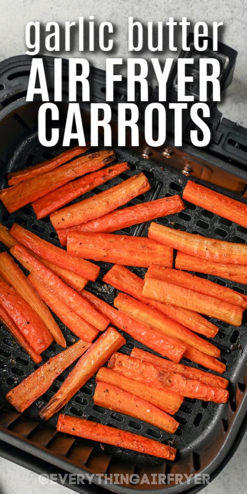Garlic butter air fryer carrots in an air fryer basket with text