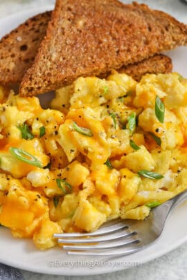 plated scrambled eggs with toast