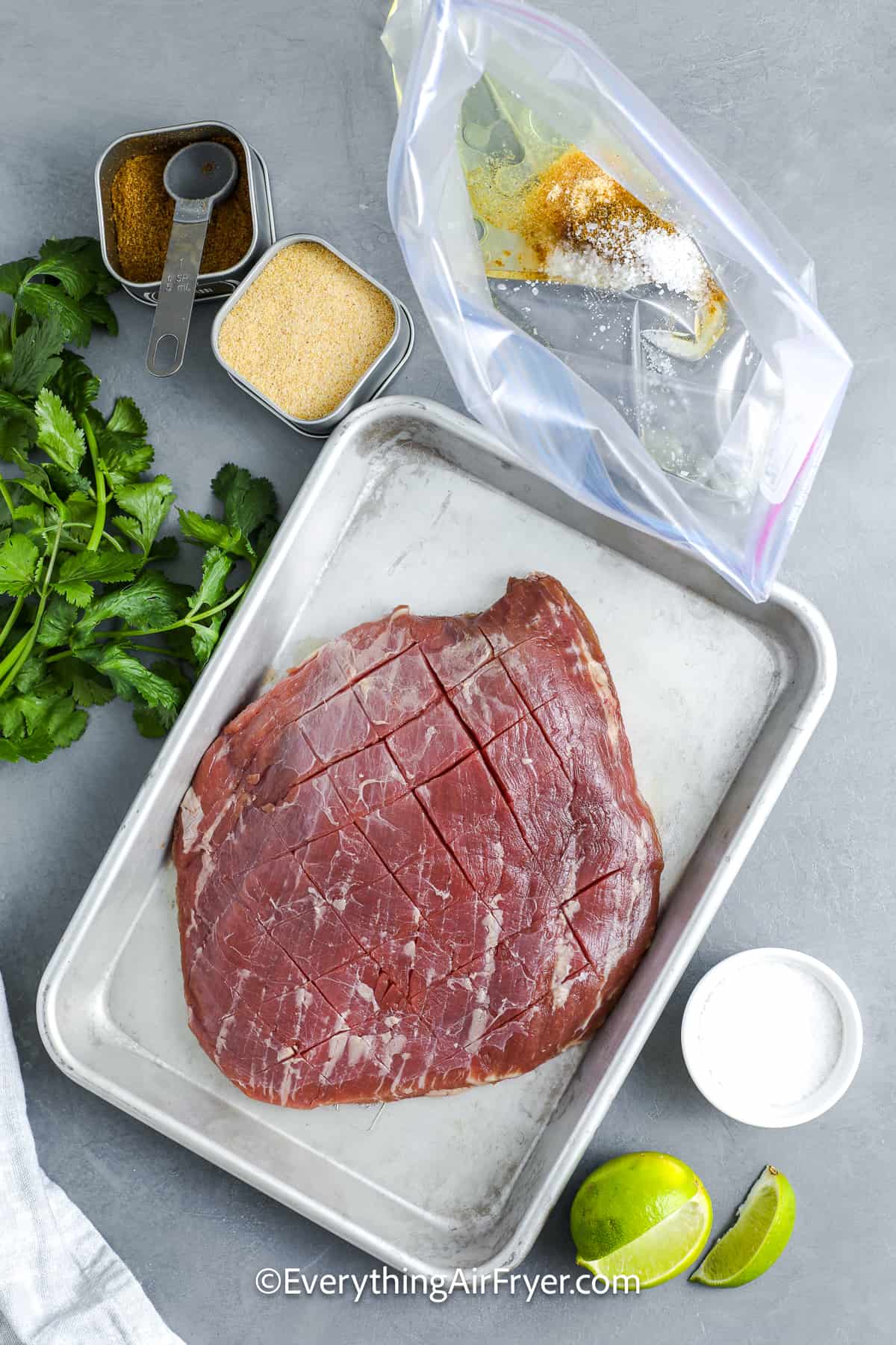 Ingredients to make Air Fryer Flank Steak with the marinade prepared in a zippered bag
