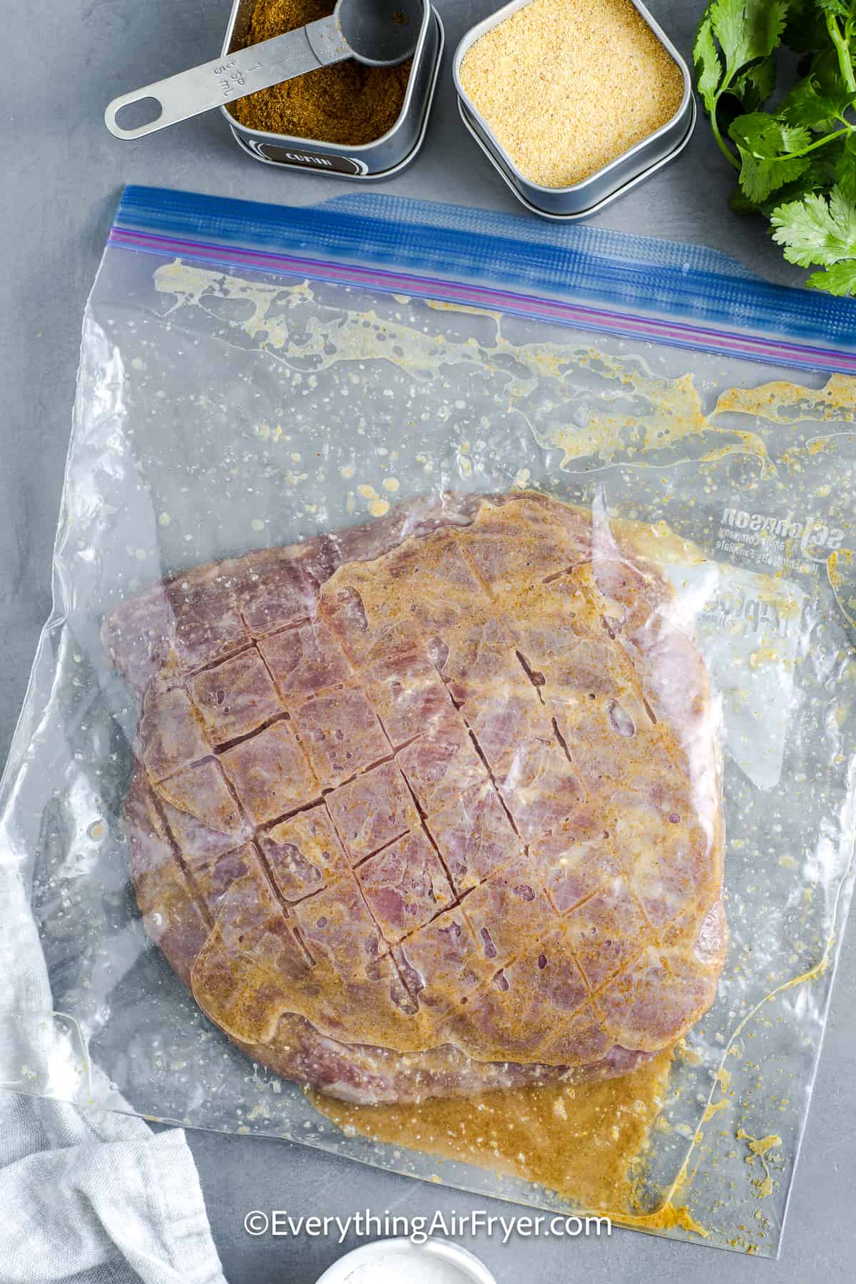 Air Fryer Flank Steak in a zippered bag marinading