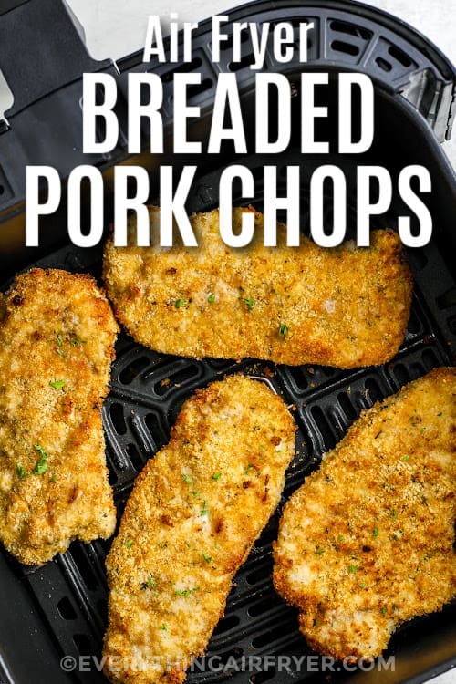 breaded pork chops cooked in an air fryer basket with a title