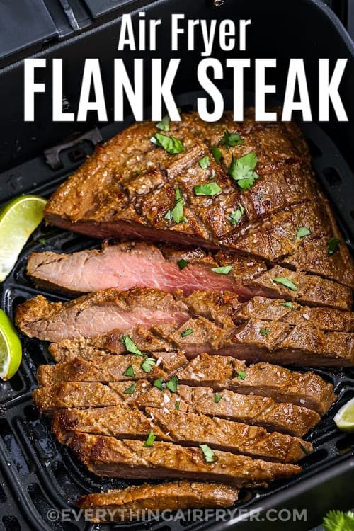 Prepared Flank Steak sliced in an air fryer basket with a title